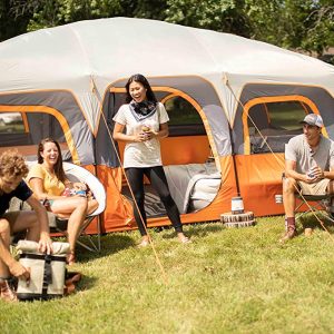 group of people bonding outside the best tent for camping with dogs