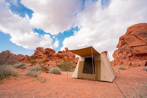 canvas tent surrounded by canyons